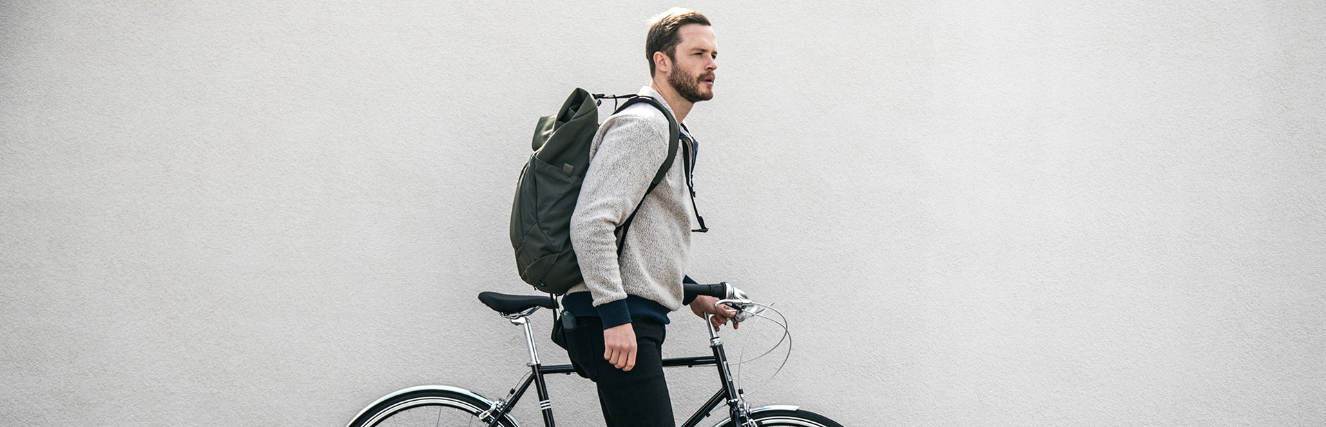 A man on PUBLIC men's bikes, men's city bikes and commuter bicycles.
